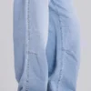 Colossus Jeans cloutés, délavage bleu clair