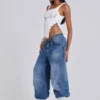Colossus Jeans cloutés « Nailed » au délavage bleu moyen
