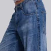 Colossus Jeans cloutés « Nailed » au délavage bleu moyen