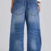 Colossus Jeans cloutés « Nailed » au délavage bleu moyen