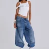 Colossus Jeans cloutés « Nailed » au délavage bleu moyen