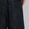 Colossus Jeans en denim enduit avec fermeture éclair