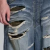 Colossus Jeans XL déchiré à motif camouflage caché