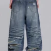 Colossus Jeans XL déchiré à motif camouflage caché