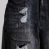 Colossus Jeans XL délavé et orné de chaînes