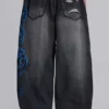 Colossus Jeans XL noir déchiré avec motif Spike Airbrush