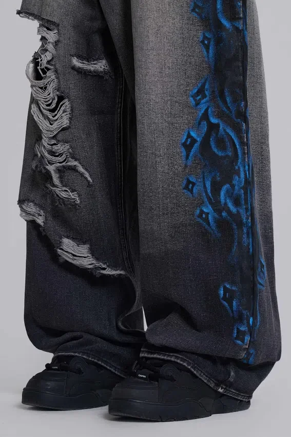 Colossus Jeans XL noir déchiré avec motif Spike Airbrush