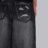 Colossus Jeans XL noir déchiré avec motif Spike Airbrush