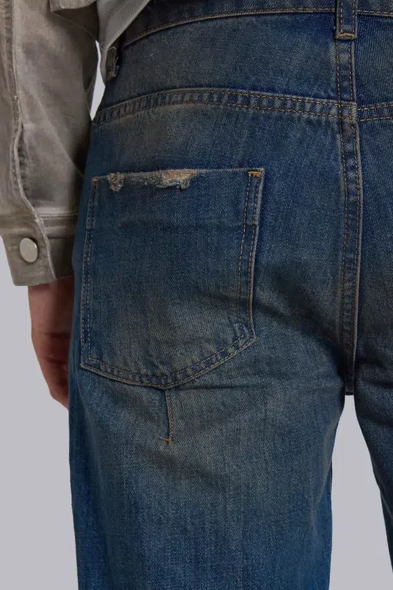 Jeans « Drain » délavés sales