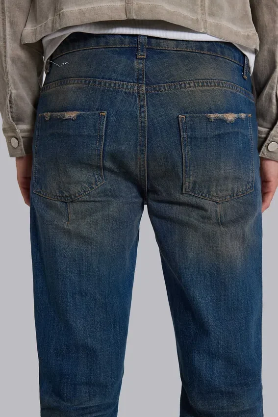 Jeans « Drain » délavés sales