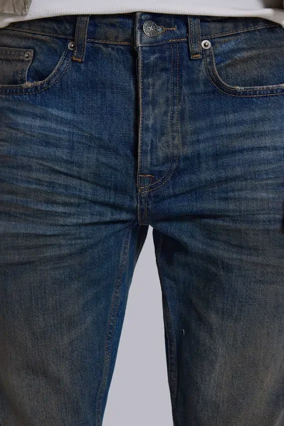Jeans « Drain » délavés sales