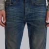 Jeans « Drain » délavés sales