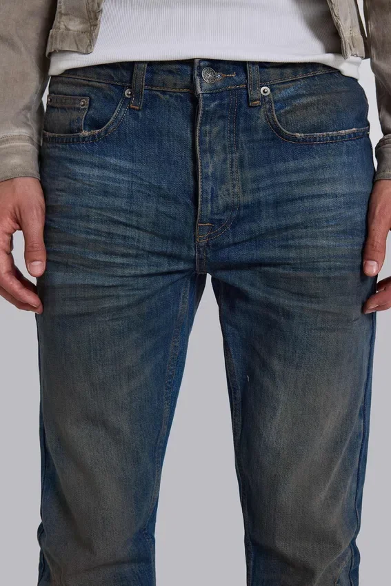 Jeans « Drain » délavés sales