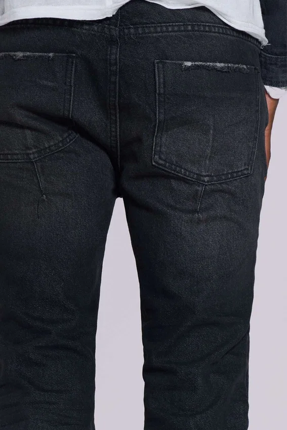 Jeans « Drain » noir délavé
