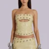 Mini-jupe cloutée en cuir synthétique Vinta