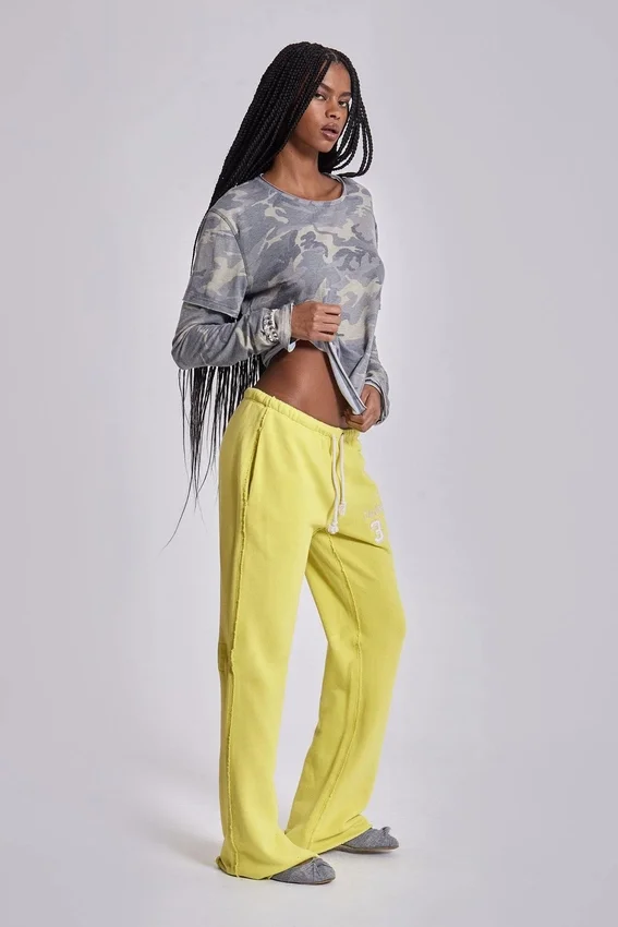Pantalon de jogging Cleo ample à coupe bootcut, couleur fluo