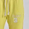 Pantalon de jogging Cleo ample à coupe bootcut, couleur fluo