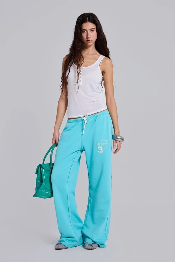 Pantalon de jogging Cleo ample à coupe bootcut, couleur turquoise