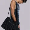 Sac à bandoulière en denim enduit « Drummer »