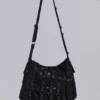 Sac à bandoulière en denim enduit « Drummer »