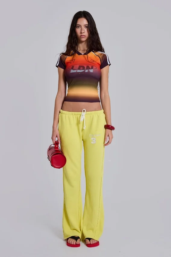 Pantalon de jogging Cleo ample à coupe bootcut, couleur fluo
